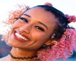 She has piercings in her nose septum and ears.